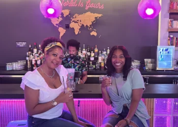 Two women holding drinks at a Birmingham Restaurant